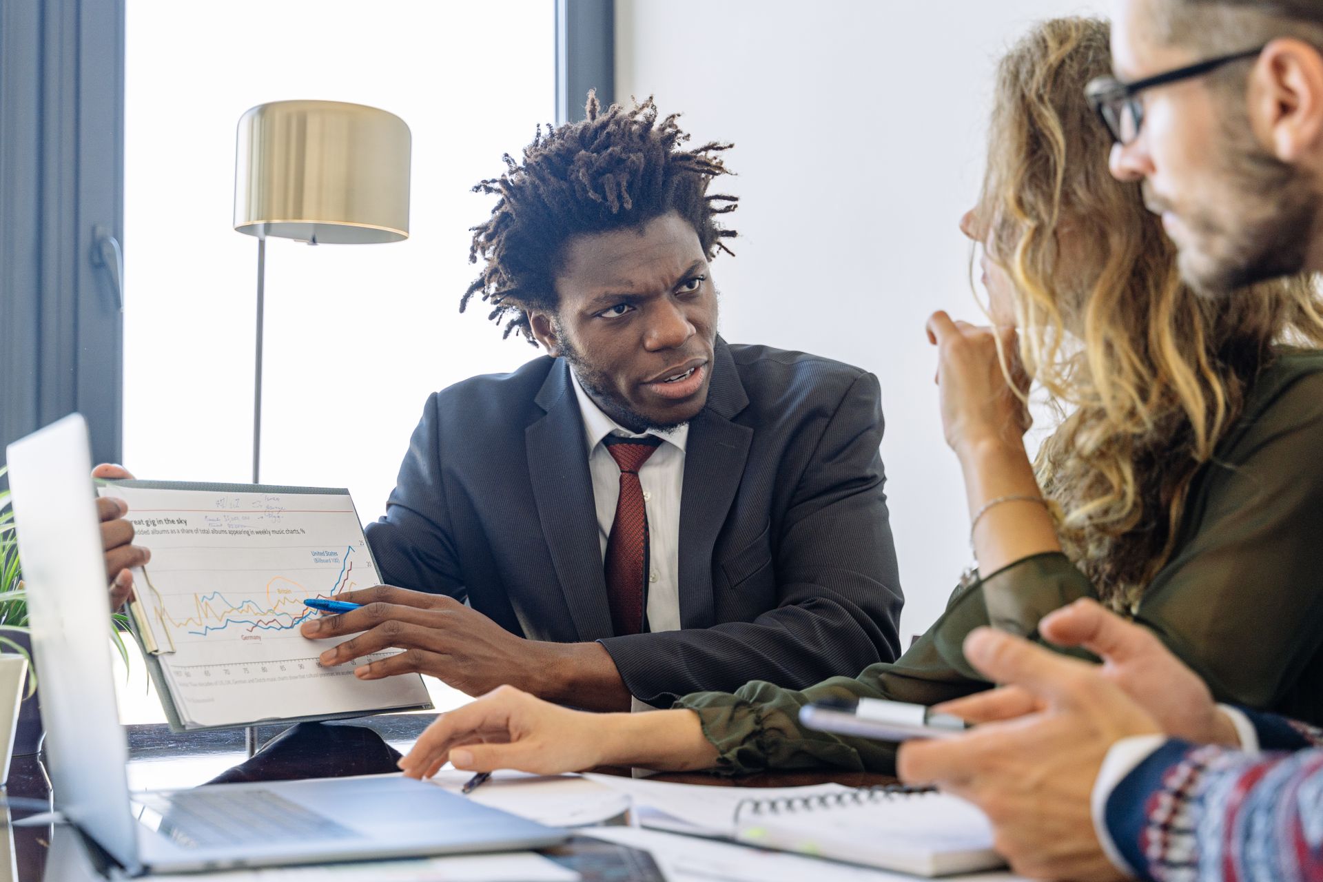 Financial advisor reviewing a retirement planning chart with a client