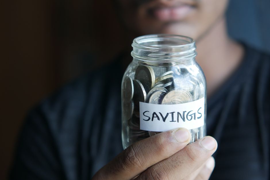 Stacked coins symbolizing incremental savings growth from a CD ladder