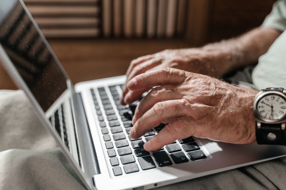 Person comparing Medicare plans on a laptop using the Medicare Plan Finder tool
