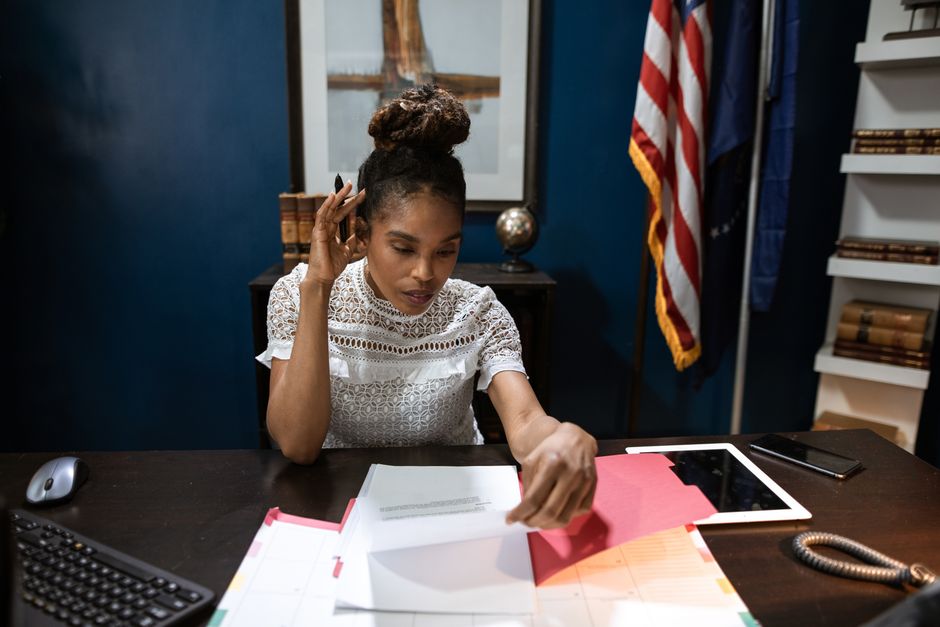 Filing property tax exclusion paperwork at a North Carolina county tax office counter