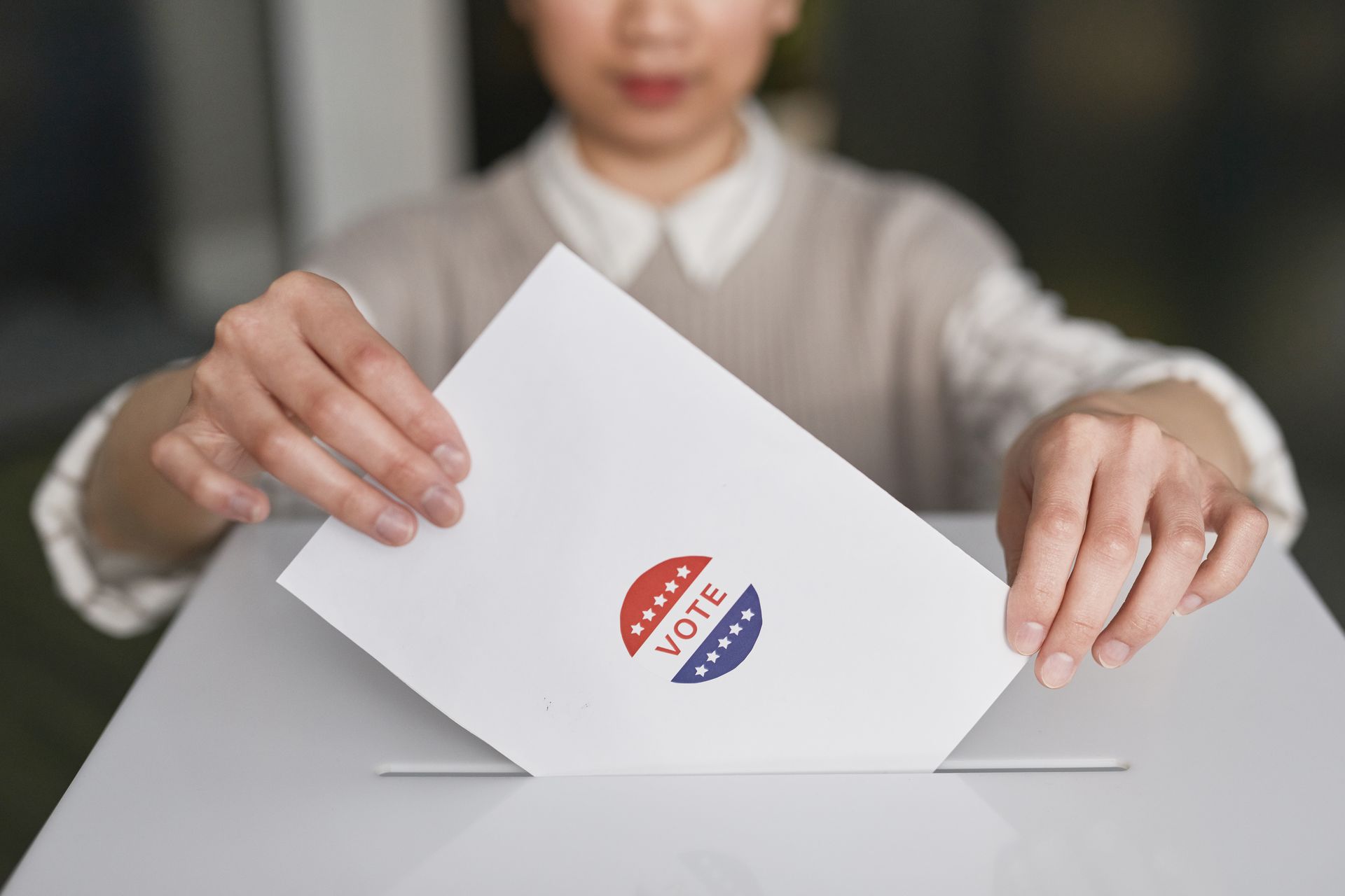 Person casting a ballot at a Florida polling place