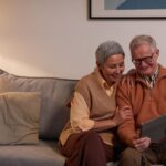 Retired couple reviewing a retirement budgeting app together