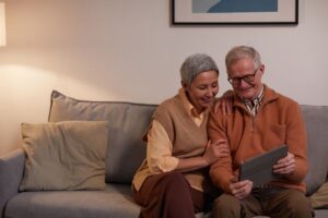 Retired couple reviewing a retirement budgeting app together