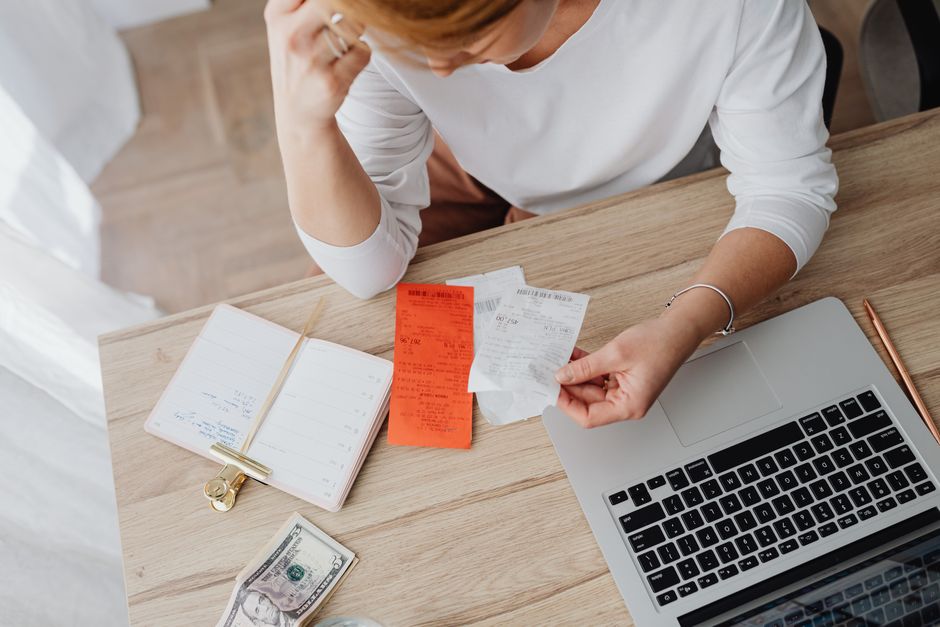surviving spouse reviewing a household budget after the loss of a spouse