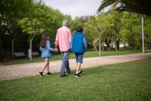 Family visiting a zoo with grandparents and grandchildren