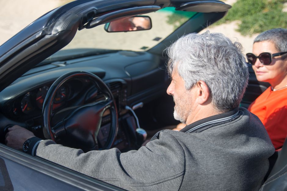 Senior couple enjoying a relaxed drive together