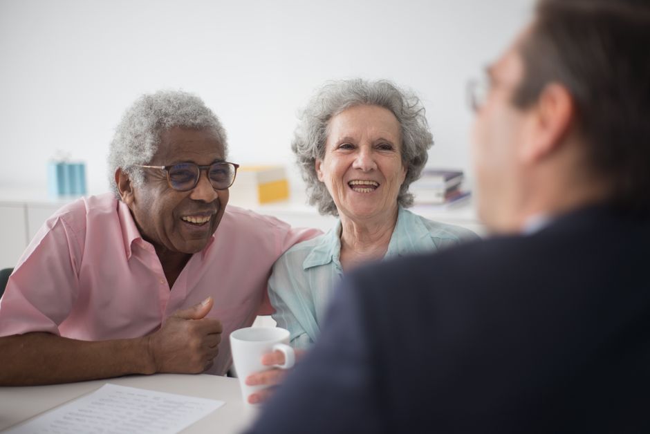 Senior couple meeting with a benefits counselor